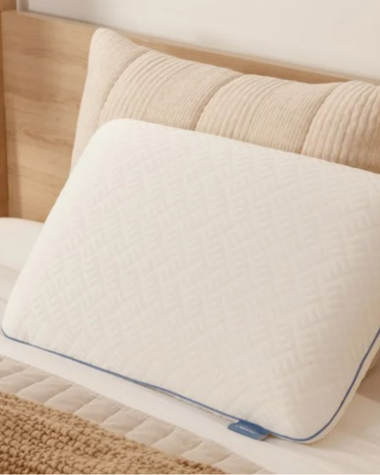 Tempur-Pedic Serenity memory foam pillow on bed, close-up of cooling knit pillow cover, side profile of medium support memory foam pillow, washable zippered pillow cover detail, standard and king size Tempur pillows side by side