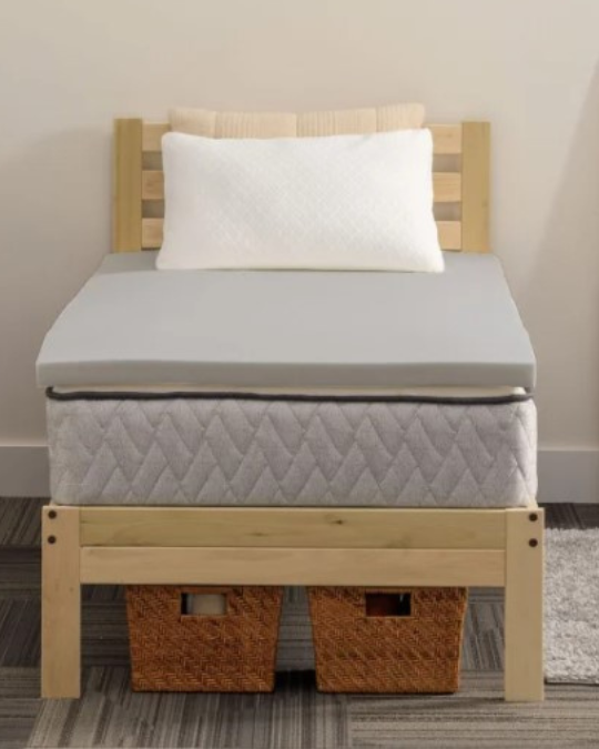Sealy dorm sleep bundle on Twin XL bed, charcoal-infused memory foam topper close-up, shredded memory foam pillow with cooling cover, Twin XL waterproof mattress protector fitted on bed, three-piece dorm bedding set displayed on mattress