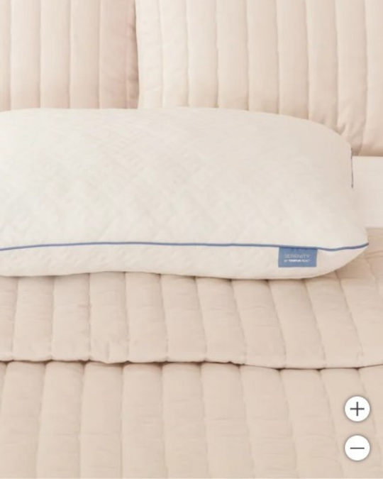 Tempur-Pedic shredded memory foam pillow, adjustable memory foam pillow on bed, close-up of pillow with removable cover, hands adjusting shredded foam, Serenity pillow king size
